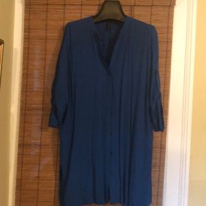 Tunic style blouse with pockets tab sleeve